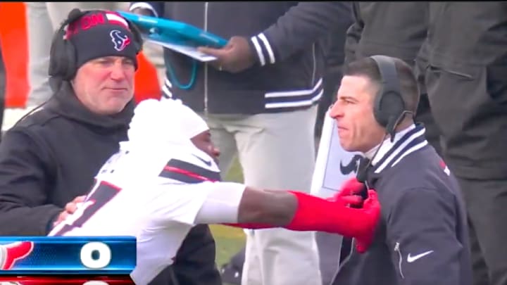 Houston Texans' Kris Boyd shoves special teams coach Frank Ross. 