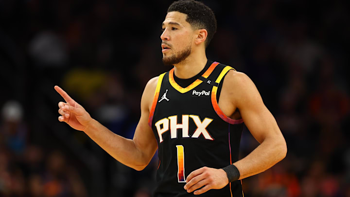 Apr 9, 2025; Phoenix, Arizona, USA; Phoenix Suns guard Devin Booker (1) reacts after a play against the Oklahoma City Thunder during the first half at Footprint Center. Mandatory Credit: Mark J. Rebilas-Imagn Images