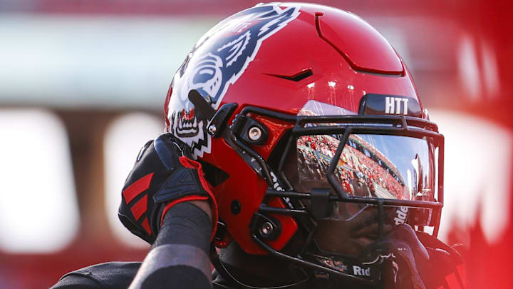 Nov 9, 2024; Raleigh, North Carolina, USA; North Carolina State Wolfpack safety KJ Martin (19) adjusts his helmet during the warmups of the game against Duke Blue Devils at Carter-Finley Stadium. Mandatory Credit: Jaylynn Nash-Imagn Images