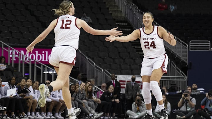 Oklahoma Sooners guard Payton Verhulst high fives forward Skylar Vann at the Big 12 Tournament. 