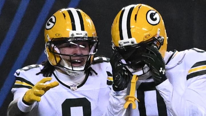 Green Bay Packers receivers Matthew Golden (0) and Christian Watson react after scoring a touchdown against the Bears.