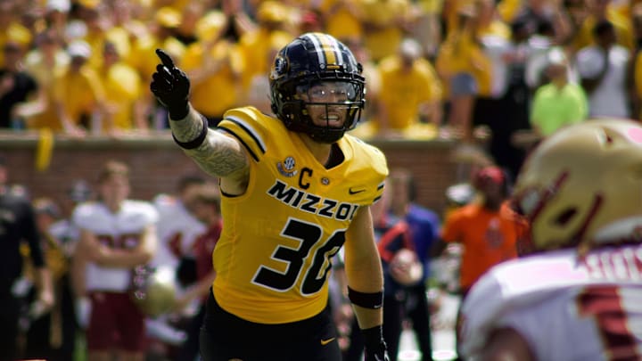 Sep 14, 2024; Columbia, Missouri, USA; Missouri Tigers linebacker Chuck Hicks (30) communicates a read before a snap against the Boston College Eagles during the second half at Faurot Field at Memorial Stadium. 