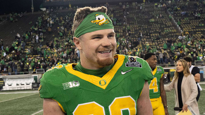 Oregon’s Bryce Boettcher celebrates the Ducks' victory over James Madison at the end of the game at Autzen Stadium in Eugene Dec. 20, 2025.