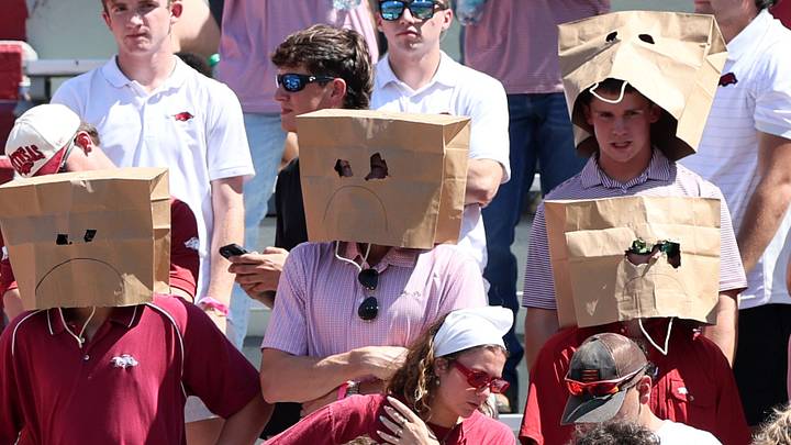 Arkansas Razorbacks fans wear paper bags over their head during the second half of the game against the Georgia Bulldogs at Donald W. Reynolds Razorback Stadium. 