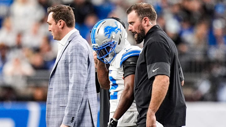Detroit Lions safety Thomas Harper (12) walks off the field due to an injury during the first half against Dallas Cowboys