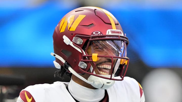 Washington Commanders quarterback Jayden Daniels celebrates after a touchdown against the Los Angeles Chargers. Washington Commanders quarterback Jayden Daniels celebrates after a touchdown against the Los Angeles Chargers.