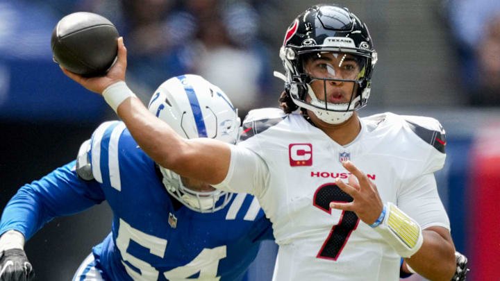 Indianapolis Colts defensive end Dayo Odeyingbo (54) moves in to tackle Houston Texans quarterback C.J. Stroud (7) on Sunday, Sept. 8, 2024, during a game against the Houston Texans at Lucas Oil Stadium in Indianapolis.