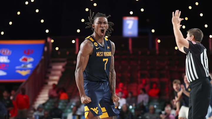 Nov 28, 2024; Paradise Island, Bahamas, BHS;  West Virginia Mountaineers guard Javon Small (7) reacts after scoring during the second half against the Louisville Cardinals at Imperial Arena at the Atlantis resort. 