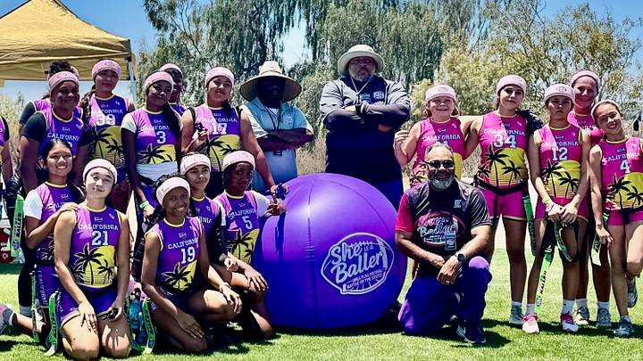 Girls Flag Football Athletes and Coaches from "She's A Baller" Tournament pose for a group photo. Girls Flag Football Athletes and Coaches from "She's A Baller" Tournament pose for a group photo.
