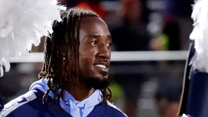 Tennessee Titan's player L'Jarius Sneed stands on the sidelines as the Blackman band takes the field before the start of the football game between Blackman and Oakland at Blackman on Friday, Sept 26, 2025.