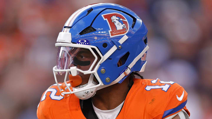 Jan 4, 2026; Denver, Colorado, USA; Denver Broncos running back RJ Harvey (12) runs with the ball during the game against the Los Angeles Chargers during the first half at Empower Field at Mile High. Mandatory Credit: Isaiah J. Downing-Imagn Images