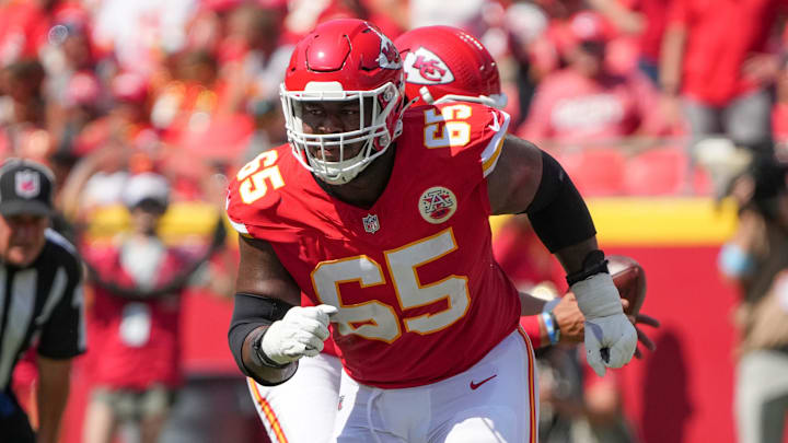 Aug 17, 2024; Kansas City, Missouri, USA; Kansas City Chiefs guard Trey Smith (65) prepares to block against the Detroit Lions during the game at GEHA Field at Arrowhead Stadium. Mandatory Credit: Denny Medley-Imagn Images