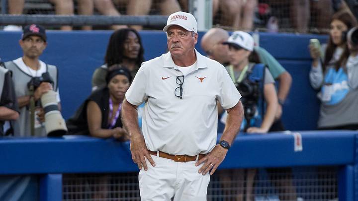 Texas Longhorns head coach Mike White looks on in the fifth inning against the Texas Tech Red Raiders during Game Two of the NCAA Women’s College World Series championship series at Devon Park. 