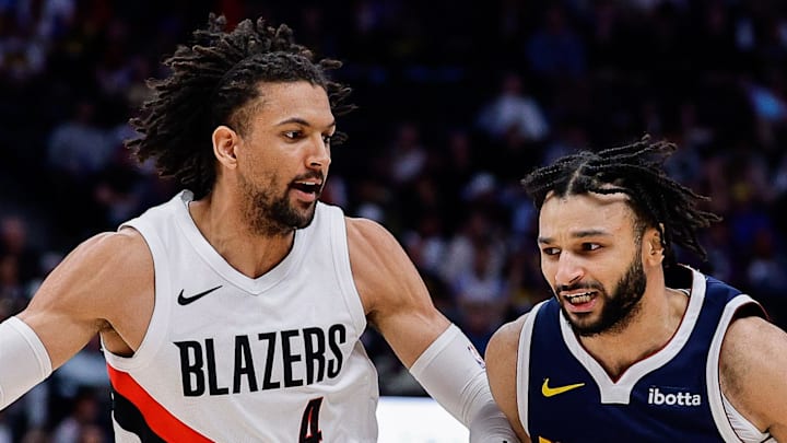 Denver Nuggets guard Jamal Murray controls the ball as Portland Trail Blazers guard Matisse Thybulle guards.