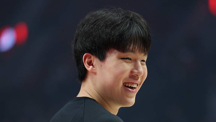 Oct 10, 2025; Portland, Oregon, USA; Portland Trail Blazers center Yang Hansen  (17) smiles at a fan before playing in a game against Sacramento Kings at Moda Center. Mandatory Credit: Jaime Valdez-Imagn Images