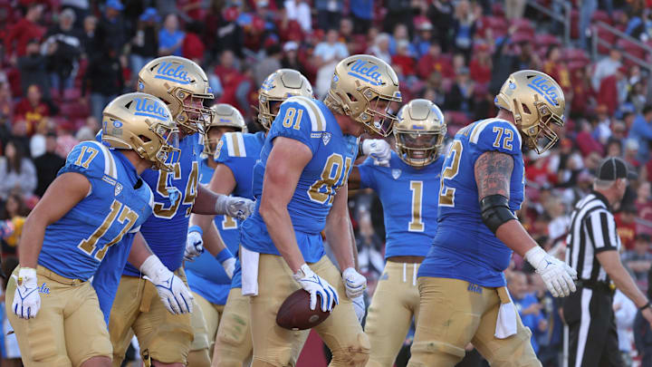 Nov 18, 2023; Los Angeles, California, USA; UCLA Bruins tight end Hudson Habermehl (81) celebrates with teammates after scoring a touchdown during the fourth quarter against the USC Trojans at United Airlines Field at Los Angeles Memorial Coliseum. Mandatory Credit: Jason Parkhurst-Imagn Images