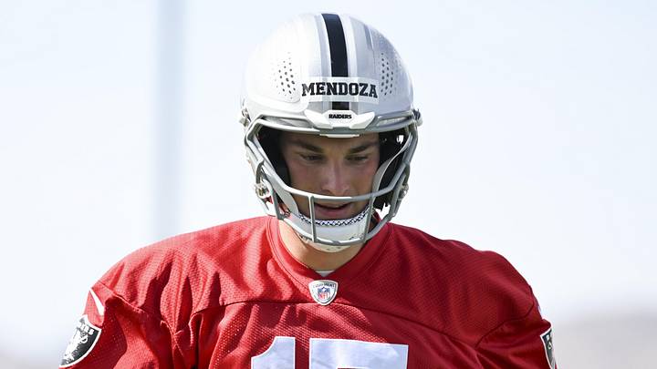 Las Vegas Raiders quarterback Fernando Mendoza warms up during organized team activities.