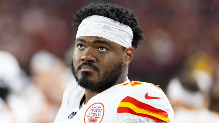 Aug 9, 2025; Glendale, Arizona, USA; Kansas City Chiefs guard Jaylon Moore (77) against the Arizona Cardinals during a preseason NFL game at State Farm Stadium. Mandatory Credit: Mark J. Rebilas-Imagn Images