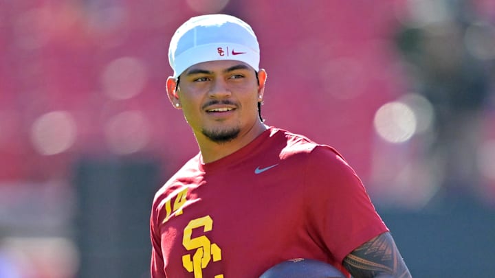 Oct 11, 2025; Los Angeles, California, USA;  USC Trojans quarterback Jayden Maiava (14) warms up prior to the game against the Michigan Wolverines at United Airlines Field at the Los Angeles Memorial Coliseum. Mandatory Credit: Jayne Kamin-Oncea-Imagn Images