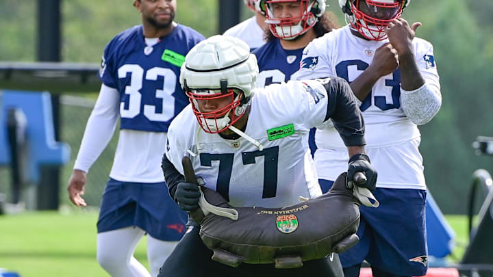 Jul 27, 2023; Foxborough, MA, USA; New England Patriots offensive tackle Trent Brown (77) works with