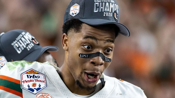 Jan 8, 2026; Glendale, AZ, USA; Miami Hurricanes wide receiver CJ Daniels (7) celebrates after defeating the Mississippi Rebels during the 2026 Fiesta Bowl and semifinal game of the College Football Playoff at State Farm Stadium. Mandatory Credit: Mark J. Rebilas-Imagn Images