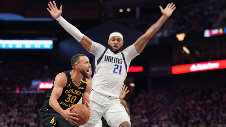 Nov 12, 2024; San Francisco, California, USA; Golden State Warriors guard Stephen Curry (30) is fouled by Dallas Mavericks forward Daniel Gafford (21) in the third quarter at the Chase Center. Mandatory Credit: Cary Edmondson-Imagn Images