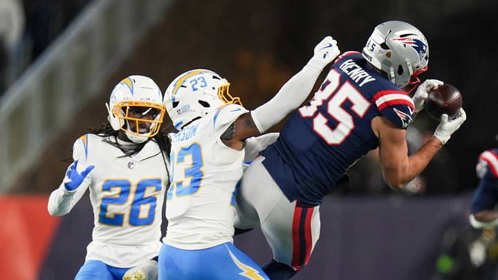 Jan 11, 2026; Foxborough, MA, USA; New England Patriots tight end Hunter Henry (85) makes a catch as Los Angeles Chargers safety Tony Jefferson (23) defends during the third quarter in an AFC Wild Card Round game at Gillette Stadium. Mandatory Credit: David Butler II-Imagn Images Jan 11, 2026; Foxborough, MA, USA; New England Patriots tight end Hunter Henry (85) makes a catch as Los Angeles Chargers safety Tony Jefferson (23) defends during the third quarter in an AFC Wild Card Round game at Gillette Stadium. Mandatory Credit: David Butler II-Imagn Images