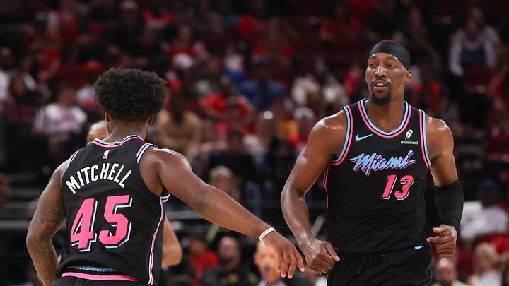 Mar 21, 2026; Houston, Texas, USA; Miami Heat center Bam Adebayo (13) reacts to guard Davion Mitchell (45) basket against the Houston Rockets in the first half at Toyota Center. Mandatory Credit: Thomas Shea-Imagn Images Mar 21, 2026; Houston, Texas, USA; Miami Heat center Bam Adebayo (13) reacts to guard Davion Mitchell (45) basket against the Houston Rockets in the first half at Toyota Center. Mandatory Credit: Thomas Shea-Imagn Images