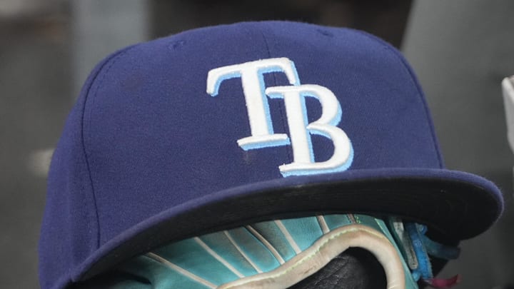Sep 26, 2025; Toronto, Ontario, CAN; The hat and glove of Tampa Bay Rays third baseman Junior Caminero (13) in the dugout during the game against the Toronto Blue Jays at Rogers Centre. 