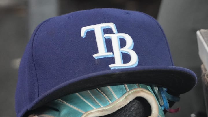 Sep 26, 2025; Toronto, Ontario, CAN; The hat and glove of Tampa Bay Rays third baseman Junior Caminero (13) in the dugout during the game against the Toronto Blue Jays at Rogers Centre. 
