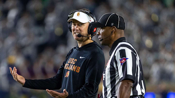 Oct 18, 2025; South Bend, Indiana, USA; Southern California Trojans head coach Lincoln Riley talks to an official during the first half against the Notre Dame Fighting Irish at Notre Dame Stadium.