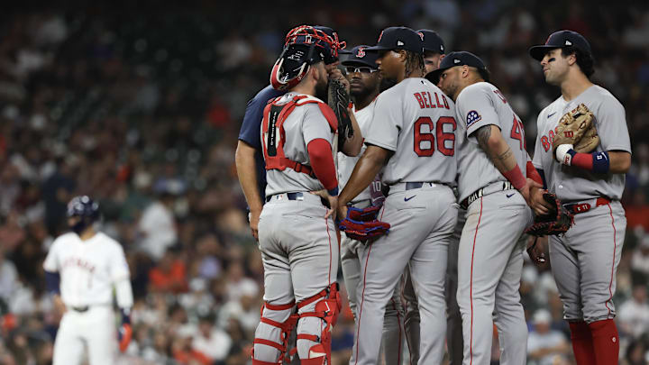 Mar 31, 2026; Houston, Texas, USA;  Boston Red Sox starting pitcher Brayan Bello (66) gets a mound visit against the Houston Astros in the fifth inning at Daikin Park. Mandatory Credit: Thomas Shea-Imagn Images