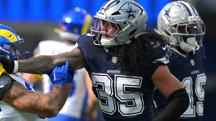 Dallas Cowboys linebacker Marist Liufau grabs a hold of Los Angeles Rams running back Cody Schrader. Dallas Cowboys linebacker Marist Liufau grabs a hold of Los Angeles Rams running back Cody Schrader.