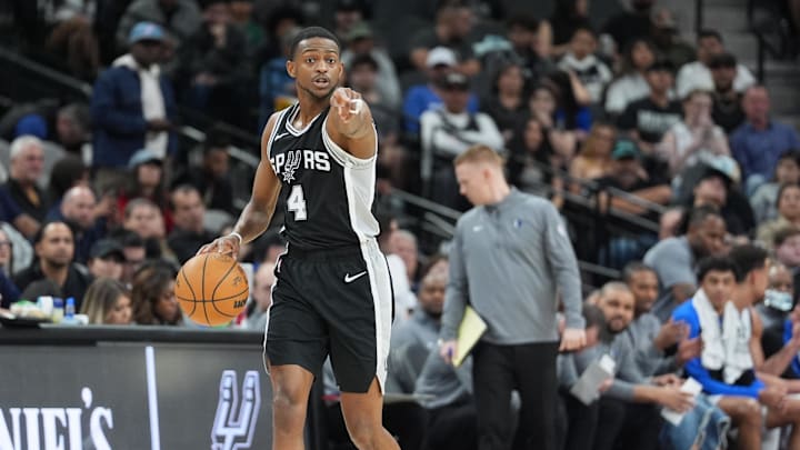 Mar 10, 2025; San Antonio, Texas, USA; San Antonio Spurs guard De'Aaron Fox (4) points in the first half against the Dallas Mavericks at Frost Bank Center.