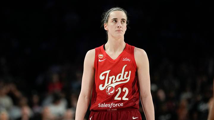 Indiana Fever guard Caitlin Clark (22) looks outward during a game.