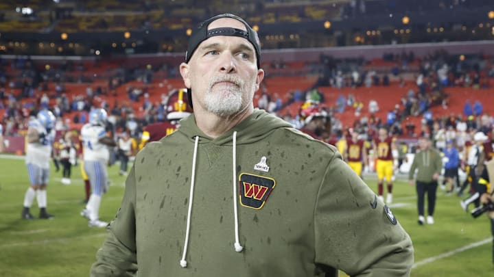 Nov 9, 2025; Landover, Maryland, USA; Washington Commanders head coach Dan Quinn stands on the field following a loss to the Detroit Lions at Northwest Stadium. Mandatory Credit: Peter Casey-Imagn Images