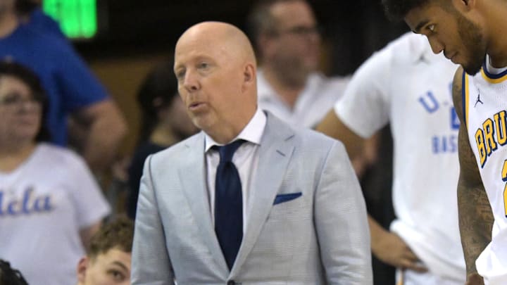 Jan 31, 2026; Los Angeles, California, USA; UCLA Bruins head coach Mick Cronin and guard Donovan Dent (2) react on the bench as the lost to the Indiana Hoosiers in double overtime at Pauley Pavilion presented by Wescom Financial. Mandatory Credit: Jayne Kamin-Oncea-Imagn Images