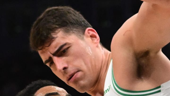 Apr 3, 2026; Milwaukee, Wisconsin, USA;  Milwaukee Bucks guard Gary Harris (11) looks for a shot against Boston Celtics forward Luka Garza (52) in the second quarter at Fiserv Forum. Mandatory Credit: Benny Sieu-Imagn Images