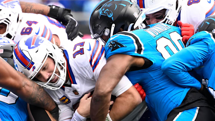 Buffalo Bills QB Josh Allen (17) scores a touchdown in the second quarter against Carolina Panthers OLB D.J. Wonnum (98) 