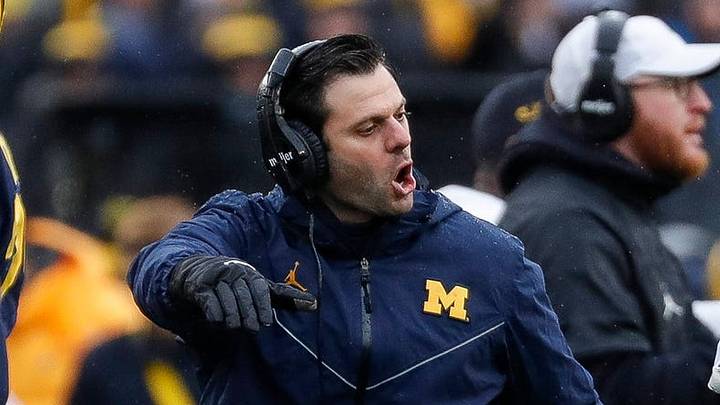Michigan linebackers coach George Helow high-fives players after a play against Nebraska during the first half of U-M's 34-3 win over Nebraska on Saturday, Nov. 12, 2022, in Ann Arbor.
