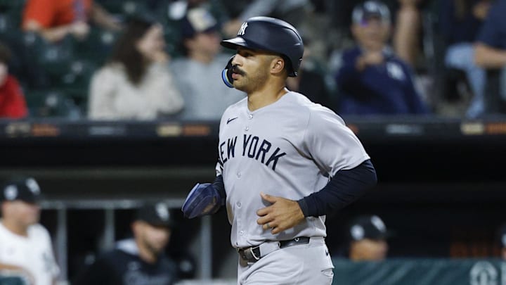 Aug 30, 2025; Chicago, Illinois, USA; New York Yankees center fielder Trent Grisham (12) scores against the Chicago White Sox during the 11th inning at Rate Field. Mandatory Credit: Kamil Krzaczynski-Imagn Images