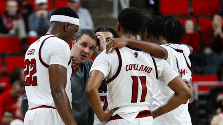 Dec 6, 2025; Raleigh, North Carolina, USA; NC State Wolfpack huddle with head coach Will Wade during the second half of the game against UNC Asheville Bulldogs at Lenovo Center. Mandatory Credit: Jaylynn Nash-Imagn Images