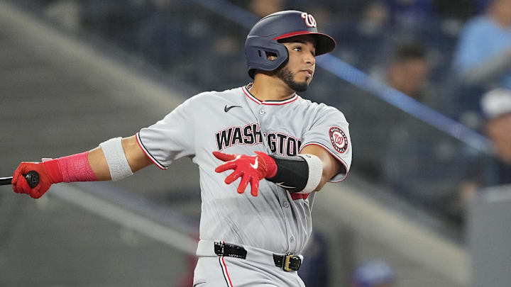 Apr 1, 2025; Toronto, Ontario, CAN; Washington Nationals catcher Keibert Ruiz (20) hits a single against the Toronto Blue Jays during the sixth inning at Rogers Centre. 