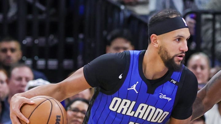 Orlando Magic guard Jalen Suggs drives to the basket against Detroit Pistons forward Tim Hardaway Jr. Orlando Magic guard Jalen Suggs drives to the basket against Detroit Pistons forward Tim Hardaway Jr.