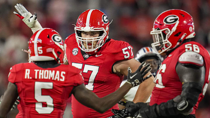 Georgia Bulldogs wide receiver Rara Thomas (5) reacts with offensive lineman Monroe Freeling (57) 