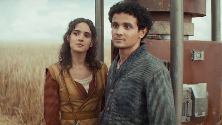 (L-R) Bix Caleen (Adria Arjona) and Wilmon Paak (Muhannad Bhaier) in Lucasfilm's Star Wars ANDOR Season 2, exclusively on Disney+. Photo courtesy of Lucasfilm. ©2025 Lucasfilm Ltd. & TM. All Rights Reserved.
