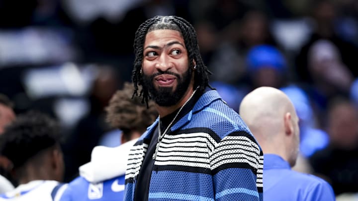 Feb 27, 2025; Dallas, Texas, USA;  Dallas Mavericks forward Anthony Davis laughs during a timeout against the Charlotte Hornets during the first half at American Airlines Center. Mandatory Credit: Kevin Jairaj-Imagn Images