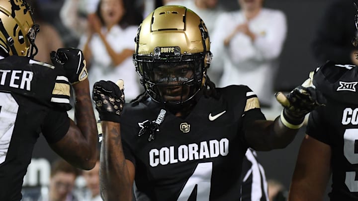 Sep 21, 2024; Boulder, Colorado, USA; Colorado Buffaloes wide receiver Omarion Miller (4) celebrates with teammates after a touchdown during the first half against the Baylor Bears at Folsom Field. Mandatory Credit: Christopher Hanewinckel-Imagn Images