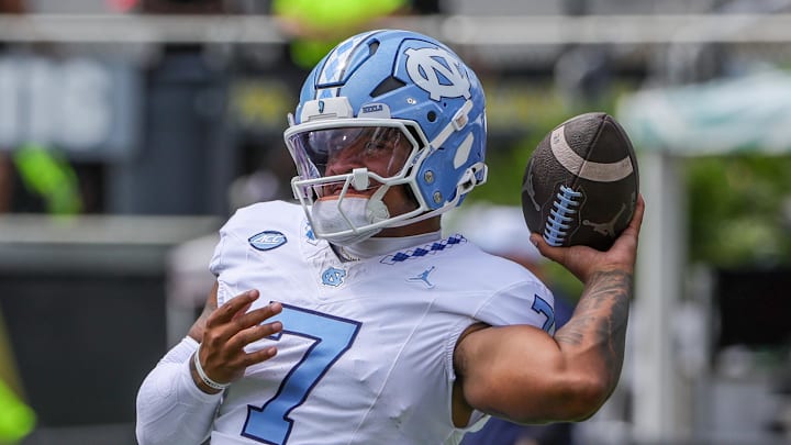 Sep 20, 2025; Orlando, Florida, USA; North Carolina Tar Heels quarterback Gio Lopez (7) warms up before the game against the UCF Knights at the Bounce House Stadium. Mandatory Credit: Mike Watters-Imagn Images