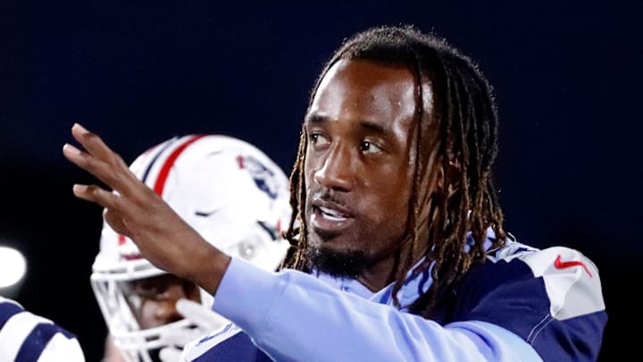 Tennessee Titan's player L'Jarius Sneed greets Oakland's Khameron Sanders (53) and other Oakland and Blackman players after the coin toss before the start of the football game between Blackman and Oakland at Blackman on Friday, Sept 26, 2025.
